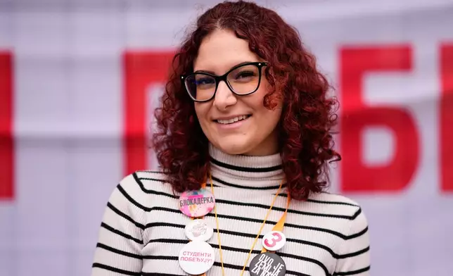 Mina Pejovic, student of pharmacy, from Belgrade, 26, poses for a photo ahead of the election in Belgrade, Serbia, Thursday, Oct. 22, 2026. (AP Photo/Petr David Josek)