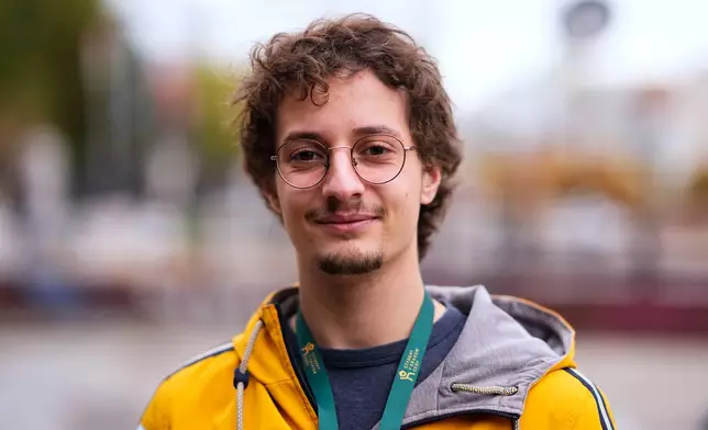 Vojislav Adamovic, student of architecture, from Belgrade, 24, poses for a photo ahead of the election in Belgrade, Serbia, Thursday, Oct. 22, 2026. (AP Photo/Petr David Josek)