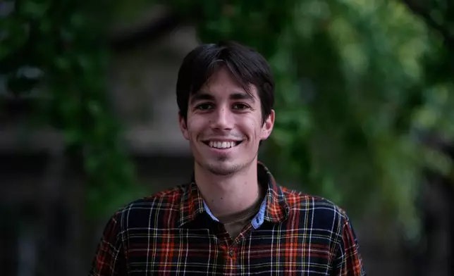 Mihajlo Zivkovic, student of computer sciences, from Pancevo, 20, poses for a photo ahead of the election in Belgrade, Serbia, Thursday, Oct. 22, 2026. (AP Photo/Petr David Josek)