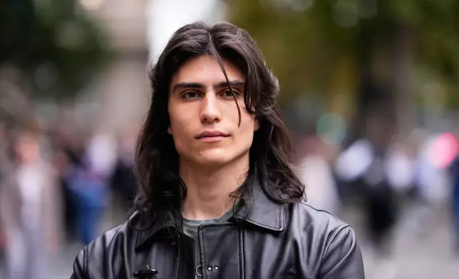 Vuk Nektarijevic, student of mechanical engineering, from Belgrade, 21, poses for a photo ahead of the election in Belgrade, Serbia, Thursday, Oct. 22, 2026. (AP Photo/Petr David Josek)