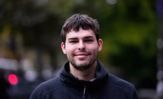 Martin Rabrenovic, student of civil engineering, from Belgrade, 20, poses for a photo ahead of the election in Belgrade, Serbia, Thursday, Oct. 22, 2026. (AP Photo/Petr David Josek)
