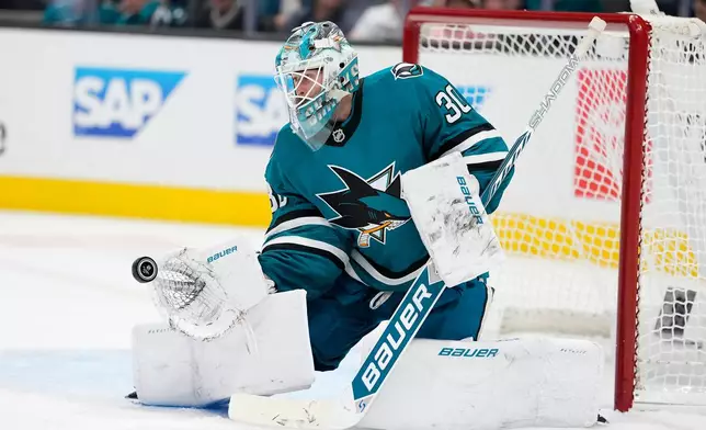 San Jose Sharks goaltender Yaroslav Askarov blocks a shot against the Edmonton Oilers during the second period of an NHL hockey game in San Jose, Calif., Saturday, Oct. 10, 2026. (AP Photo/Tony Avelar)