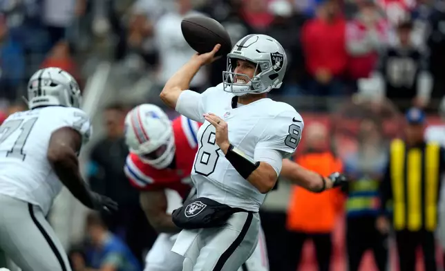 Las Vegas Raiders quarterback Kirk Cousins (8) looks to pass against the New England Patriots during an NFL football game in Foxborough, Mass., Sunday, Oct. 11, 2026. (AP Photo/Charles Krupa)