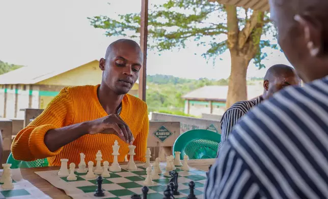 Brian Gatonye, 2, a Kenyan prisoner, plays chess at Maranjau Prison in Murang'a, Kenya, on Sept. 11, 2026. (AP Photo/Patrick Ngugi)