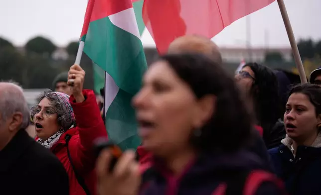People shout slogans during a protest outside Haydarpasa port calling for the end of shipments to Israel, in Istanbul, Turkey, Friday, Oct. 30, 2026. (AP Photo/Emrah Gurel)
