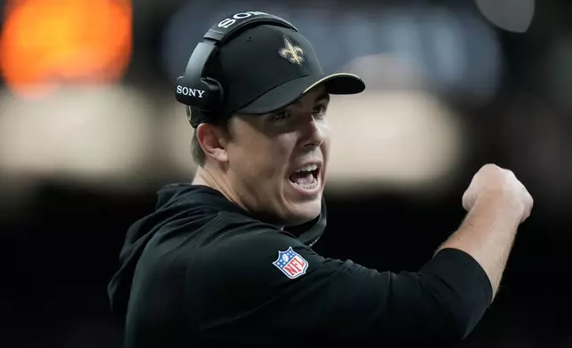 New Orleans Saints head coach Kellen Moore gestures toward officials during the first half of an NFL football game against the Atlanta Falcons in New Orleans, Monday, Oct. 5, 2026. (AP Photo/Gerald Herbert)