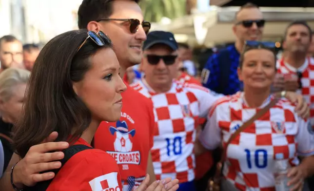 Ashton and Zachary Smith gather with Croatian supporters prior to the Nations League soccer match between Croatia and Spain, in Split, Croatia, Tuesday, Oct. 6, 2026. (AP Photo)
