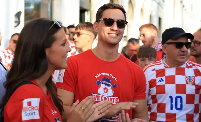 Ashton and Zachary Smith gather with Croatian supporters prior to the Nations League soccer match between Croatia and Spain, in Split, Croatia, Tuesday, Oct. 6, 2026. (AP Photo)