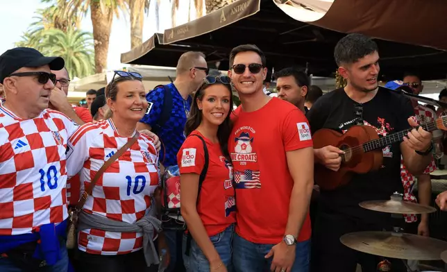 Ashton and Zachary Smith pose with Croatian supporters prior to the Nations League soccer match between Croatia and Spain, in Split, Croatia, Tuesday, Oct. 6, 2026. (AP Photo)