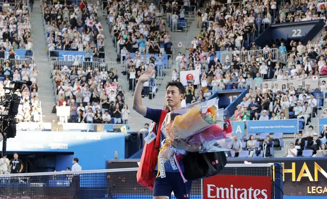 Japan's Kei Nishikori waves to the spectators after his first round loss to Frances Tiafoe at the Japan Open tennis in Tokyo, Thursday, Oct. 1, 2026. (Daiki Katagiri/Kyodo News via AP)