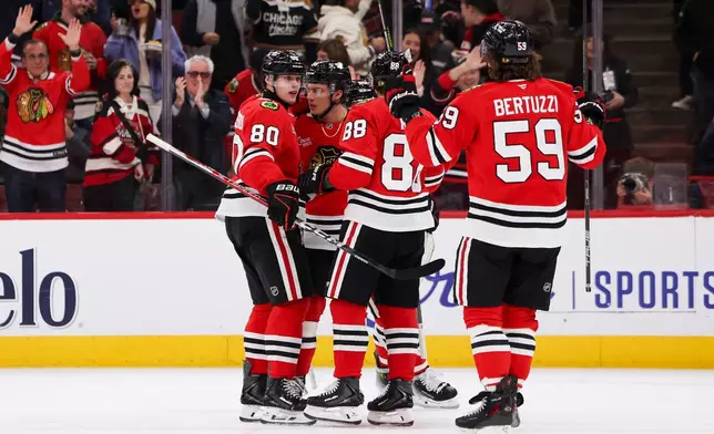 Chicago Blackhawks right wing Roman Kantserov (80) celebrates a goal teammates during the second period of an NHL hockey game against the Los Angeles Kings, Tuesday, Oct. 27, 2026, in Chicago. (AP Photo/Jessie Alcheh)