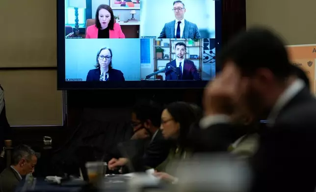 From top left, OpenAI's Morgan Dwyer, Meta's Shane Cahill, Googe's Alice Friend, and Anthropic's Logan Graham testify via zoom at the New York City Council hearing on artificial intelligence safety in New York, Monday, Oct. 5, 2026. (AP Photo/Seth Wenig)