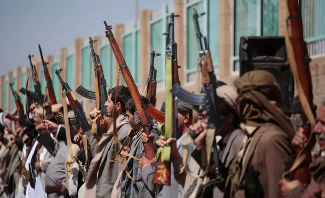 Houthi supporters carry their rifles while attending an armed tribal rally in Sanaa, Yemen, Wednesday, Oct. 7, 2026. (AP Photo/Osamah Abdulrahman)