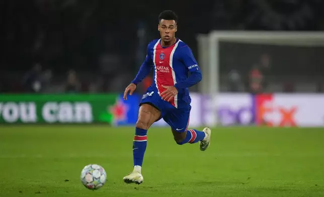 PSG's Desire Doue runs with the ball during the Champions League opening phase soccer match between Paris Saint-Germain and FC Barcelona in Paris, Tuesday, Oct. 20, 2026. (AP Photo/Thibault Camus)