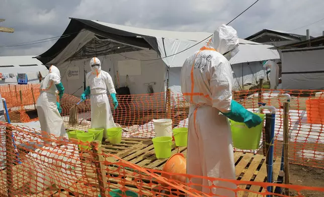 Health workers clean equipment inside a Ebola treatment camp in Butembo, Congo, Wednesday, Sept. 30, 2026. (AP Photo/Sebastien Kitsa Musayi)
