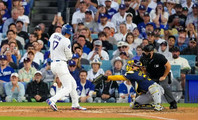 Los Angeles Dodgers designated hitter Shohei Ohtani is hit by pitch during the fourth inning of Game 3 of baseball's National League Championship Series between the Milwaukee Brewers and the Los Angeles Dodgers, Wednesday, Oct. 14, 2026, in Los Angeles. (AP Photo/Mark J. Terrill)
