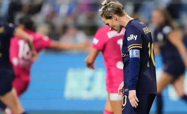 Seattle Reign FC midfielder Jess Fishlock looks down during the second half of an NWSL soccer match against the North Carolina Courage, Friday, Oct. 2, 2026, in Seattle. (AP Photo/Lindsey Wasson)