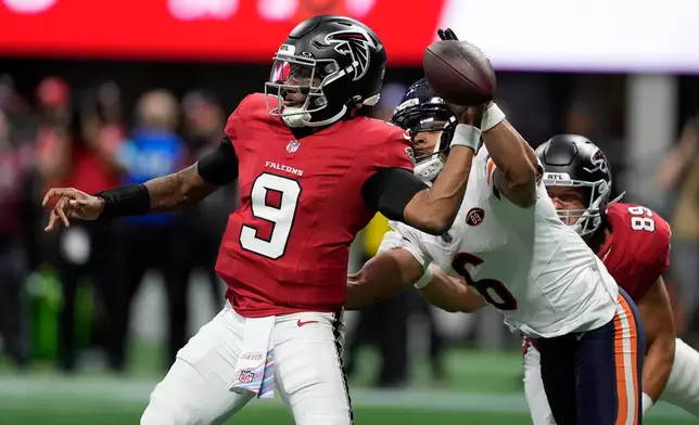 Chicago Bears cornerback Kyler Gordon (6) pressures Atlanta Falcons quarterback Michael Penix Jr. (9) during the second half of an NFL football game in Atlanta, Sunday, Oct. 18, 2026. (AP Photo/Brynn Anderson)