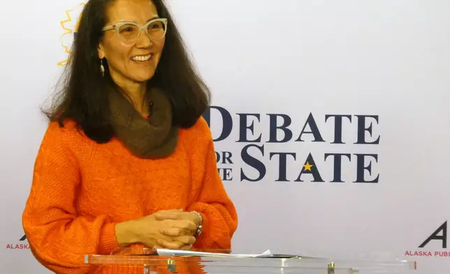 In this photo shot with a smart phone, Democrat Mary Peltola smiles ahead of a debate with Republican U.S. Sen. Dan Sullivan in Alaska's Senate race, Thursday, Oct. 15, 2026, in Anchorage, Alaska. (AP Photo/Becky Bohrer)