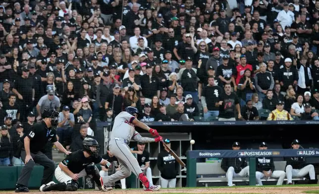 Cleveland Guardians' José Ramírez hits a two-run triple against Chicago White Sox pitcher David Sandlin during the eighth inning in Game 3 of baseball's American League Division Series Wednesday, Oct. 7, 2026, in Chicago. (AP Photo/Nam Y. Huh)