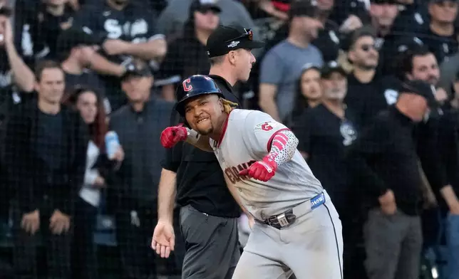 Cleveland Guardians' José Ramírez reacts after hitting a two-run triple against Chicago White Sox pitcher David Sandlin during the eighth inning in Game 3 of baseball's American League Division Series Wednesday, Oct. 7, 2026, in Chicago. (AP Photo/Nam Y. Huh)