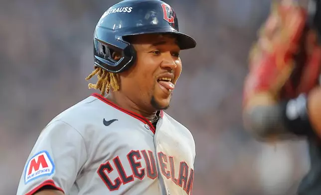 Cleveland Guardians' José Ramírez reacts after hitting a two-run triple against Chicago White Sox pitcher David Sandlin during the eighth inning in Game 3 of baseball's American League Division Series Wednesday, Oct. 7, 2026, in Chicago. (AP Photo/Melissa Tamez)