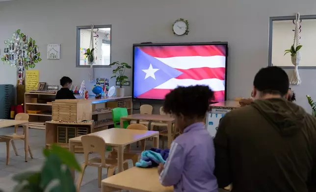 A Puerto Rican flag is displayed on a screen in a classroom at the John Cardinal O’Connor Center for Parent and Child Development, a Head Start center operated by The New York Foundling, in San Juan, Puerto Rico, Tuesday, Oct. 13, 2026. (AP Photo/Alejandro Granadillo)