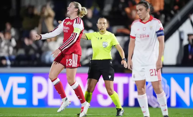 Arsenal's Alessia Russo, left, celebrates scoring their side's first goal during the Women's Champions League soccer match between Arsenal and Benfica in London, Wednesday, Oct. 28, 2026. (Mike Egerton/PA via AP)
