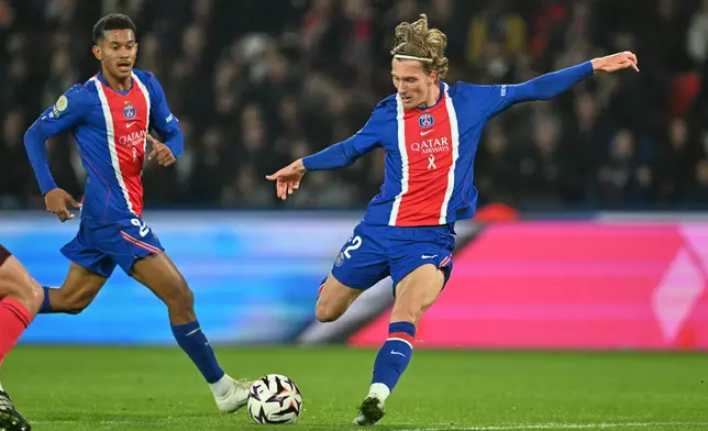 PSG's Mika Godts scores his side's second goal during the French League One soccer match between Paris Saint-Germain and Lyon in Paris, Monday, Oct. 26, 2026. (AP Photo/Emma Da Silva)