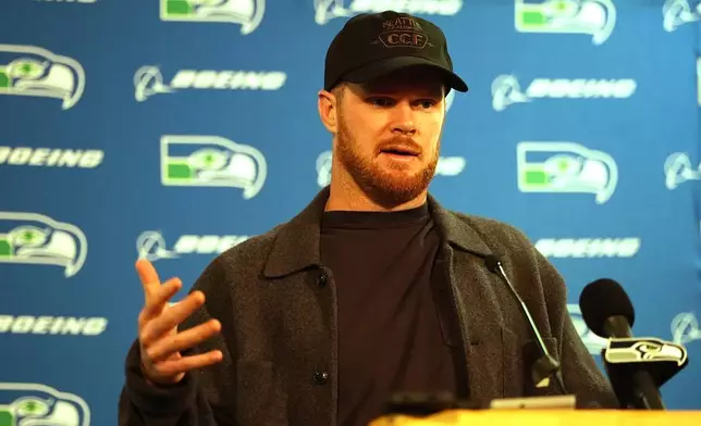 Seattle Seahawks quarterback Sam Darnold responds to reporters' questions during a news conference after an NFL football game Thursday, Oct. 15, 2026, in Denver. (AP Photo/David Zalubowski)
