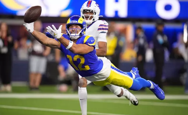 Los Angeles Rams wide receiver Puka Nacua, left, can't reach a pass in the end zone as Buffalo Bills running back Frank Gore Jr. watches during the first half of an NFL football game, Monday, Oct. 12, 2026, in Inglewood, Calif. (AP Photo/Gregory Bull)