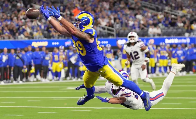 Los Angeles Rams tight end Tyler Higbee, left, can't get to a pass in the end zone as Buffalo Bills safety Cole Bishop defends and was called for pass interference during the second half of an NFL football game, Monday, Oct. 12, 2026, in Inglewood, Calif. (AP Photo/Gregory Bull)
