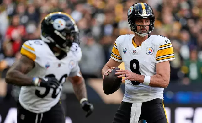 Pittsburgh Steelers quarterback Aaron Rodgers (8) looks to pass during an NFL football game against New Orleans Saints in Saint-Denis, outside Paris, Sunday, Oct. 25, 2026. (AP Photo/Steve Luciano)