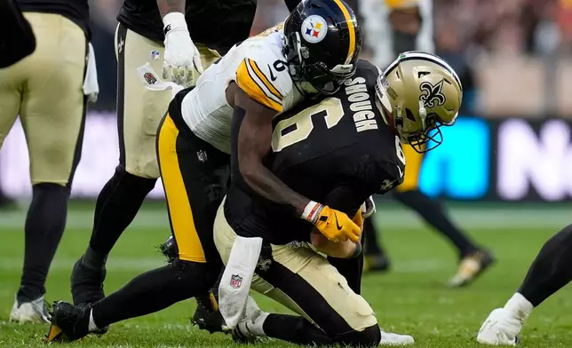 Pittsburgh Steelers linebacker Patrick Queen (6) sacks on New Orleans Saints quarterback Tyler Shough (6) during an NFL football game in Saint-Denis, outside Paris, Sunday, Oct. 25, 2026. (AP Photo/Steve Luciano)