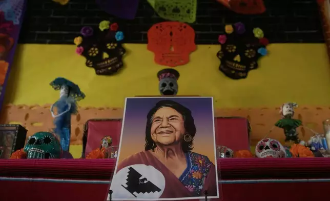 A photo of the late Dolores Huerta is on display as part of a "Dia de los Muertos" altar display at Dolores Huerta Elementary School, Wednesday, Oct. 28, 2026, in San Francisco. (AP Photo/Jeff Chiu)