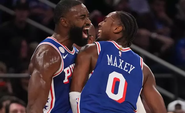 Philadelphia 76ers guard Jaylen Brown, left, celebrates a three-point basket with teammate guard Tyrese Maxey during the second half of an NBA basketball game against the New York Knicks Tuesday, Oct. 20, 2026, in New York. (AP Photo/Frank Franklin II)