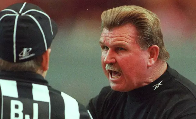 FILE - New Orleans Saints head coach Mike Ditka, right, yells at offical Bill Lovett during he first half of the Saints 20-3 loss to the Falcons in Atlanta, Sunday, Nov. 23, 1997. (AP Photo/Alan Mothner, File)