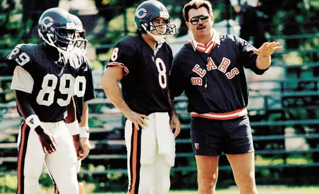 FILE - Chicago Bears coach Mike Ditka talks with quarterback Mike Hohensee during NFL football practice, Thursday, Sept. 25, 198, in Lake Forest, Ill. (AP Photo/Charles Bennet, File)