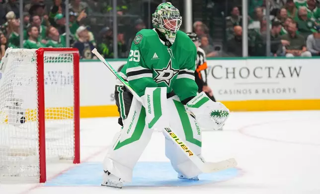 Dallas Stars goaltender Jake Oettinger defends his net against the St. Louis Blues during the second period of an NHL hockey game Friday, Oct. 2, 2026, in Dallas. (AP Photo/Julio Cortez)