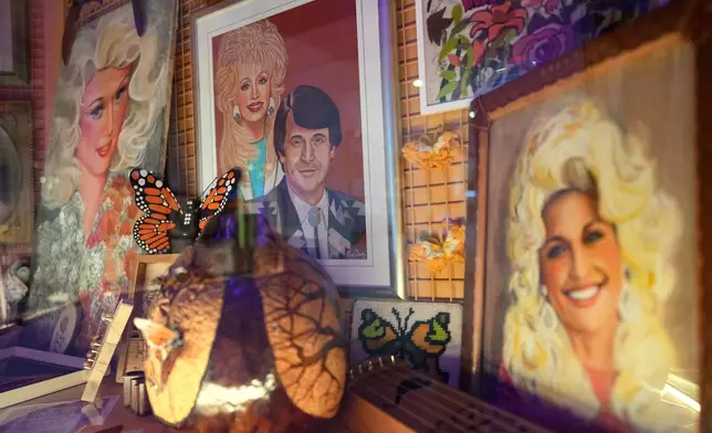 Portraits of Dolly Parton are seen at the Dolly's Life of Many Colors Museum, Tuesday, Oct. 6, 2026, in Nashville, Tenn. (AP Photo/George Walker IV)