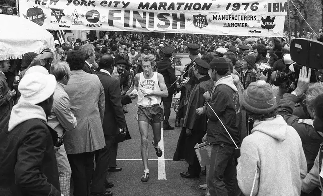 FILE - Bill Rodgers, of Melrose, Mass., crosses the finish line to win the New York City Marathon, Sunday, Oct. 24, 1976. (AP Photo/File)