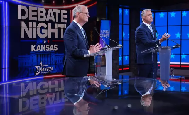 Republican Sen. Roger Marshall, right, and Democratic nominee for U.S. Senate Adam Hamilton participate in a debate at WDAF TV in Kansas City, Mo., Wednesday, Oct. 21, 2026. (AP Photo/Charlie Riedel, Pool)