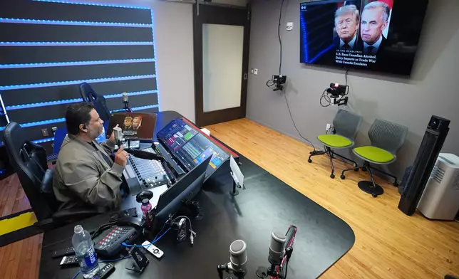 Victor Martinez, who runs La Mega 101.7, a Spanish-language radio station in Pennsylvania's Lehigh Valley, hosts a politics talk show from his studio in Allentown, Pa., on Sept. 29, 2026. (AP Photo/Matt Rourke)