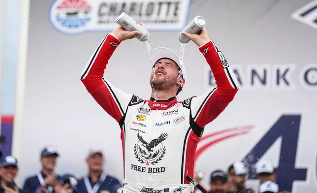 Chase Briscoe celebrates in Victory Lane after winning a NASCAR Cup Series auto race, Sunday, Oct. 11, 2026, in Concord, N.C. (AP Photo/Matt Kelley)