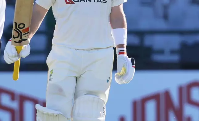 Australia's Josh Inglis celebrates his fifty on day two of the third cricket test match between South Africa and Australia, in Cape Town, South Africa, Wednesday, Oct. 28, 2026. (AP Photo/Halden Krog)