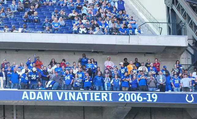 Indianapolis Colts former place-kicker Adam Vinatieri's name is displayed on the team's Ring of Honor during halftime of an NFL football game against the Tennessee Titans, Sunday, Oct. 18, 2026, in Indianapolis. (AP Photo/AJ Mast)