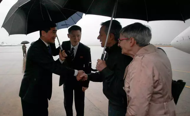Swiss Foreign Minister Ignazio Cassis, center right, is greeted by officials of North Korea's ministry of foreign affairs on the arrival at Pyongyang International Airport in Pyongyang, North Korea, on Thursday, Oct. 29, 2026. (AP Photo/Jon Chol Jin)