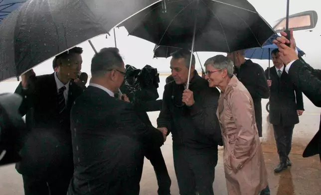 Swiss Foreign Minister Ignazio Cassis and his delegation are greeted by officials of North Korea's ministry of foreign affairs on the arrival at Pyongyang International Airport in Pyongyang, North Korea, on Thursday, Oct. 29, 2026. (AP Photo/Jon Chol Jin)
