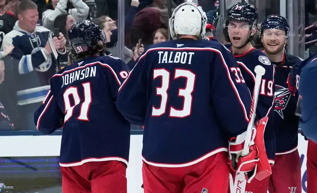 Columbus Blue Jackets celebrate after defeating the Pittsburgh Penguins in an NHL hockey game in Columbus, Ohio, Friday, Oct. 9, 2026. (AP Photo/Sue Ogrocki)