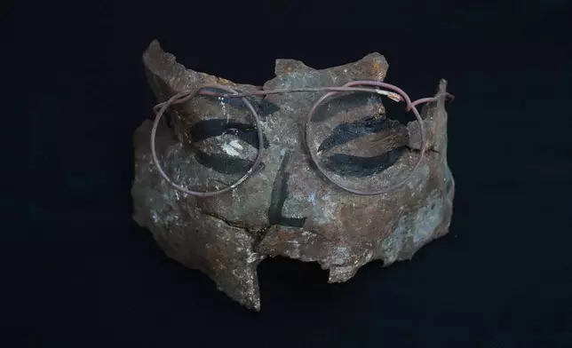An artwork depicting a face wearing glasses, created by visual artist Lina Jouni from shrapnel collected from Israeli military munitions, is displayed at her home in the village of Roumin, southern Lebanon, Sunday, Oct. 25, 2026. (AP Photo/Hassan Ammar)